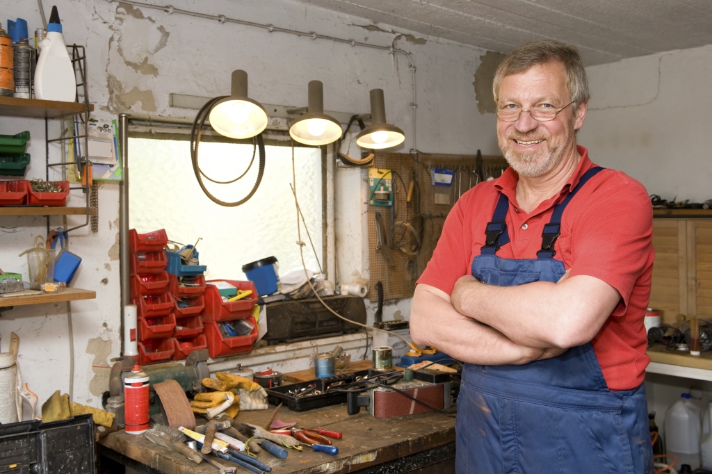 man standing with his finished workbench